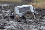 Image of a car stuck in the mud