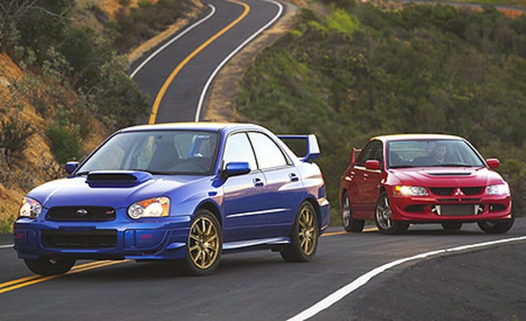 WRX Vs Lancer Evo image source www.caranddriver.com 1024x625 Subaru WRX vs. Lancer Evo: Battle Royale